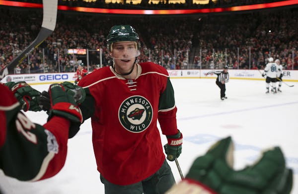 Minnesota Wild center Charlie Coyle (3) was congratulated by the bench after he scored the second Wild goal of the second period. ] JEFF WHEELER &#xef