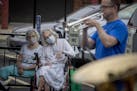 Residents at the Lyngblomsten Senior Center listened as a brass ensemble from the Minnesota Orchestra, including trumpet player Charles Lazarus, surpr