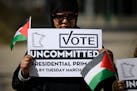 Semira Ibrahim of Apple Valley held a sign urging voters to vote "uncommitted" in Minnesota's presidential primary. The "uncommitted" option won 46,00
