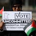 Semira Ibrahim of Apple Valley held a sign urging voters to vote "uncommitted" in Minnesota's presidential primary. The "uncommitted" option won 46,00
