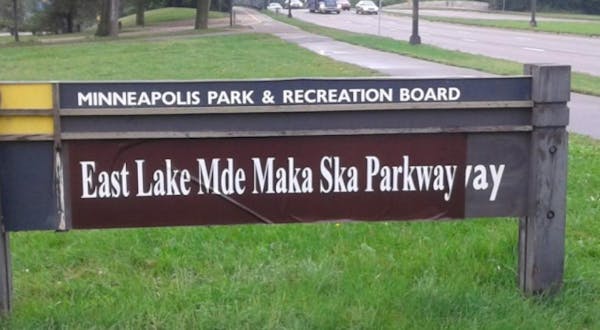 This sign posted Wednesday around Lake Calhoun uses one version of the Dakota name. The vote Wednesday night opted to use the preferred modern spellin