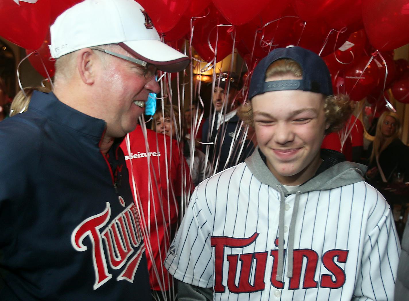 University of Minnesota head football coach Jerry Kill had a laugh with Travis Boyums of Rosemount at Kieran's Irish Pub. Jerry Kill and Travis Boyums will throw out the first pitch at the Twins game. ] JOELKOYAMA&#x201a;&#xc4;&#xa2;jkoyama@startribune Minneapolis, MN on May 15, 2014.