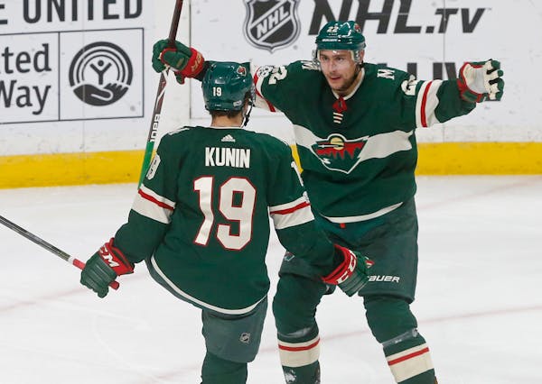 Wild winger Nino Niederreiter, right, celebrated with Luke Kunin after Kunin's goal in the third period off Jets goalie Connor Hellebuyck on Tuesday.