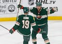 Wild winger Nino Niederreiter, right, celebrated with Luke Kunin after Kunin's goal in the third period off Jets goalie Connor Hellebuyck on Tuesday.