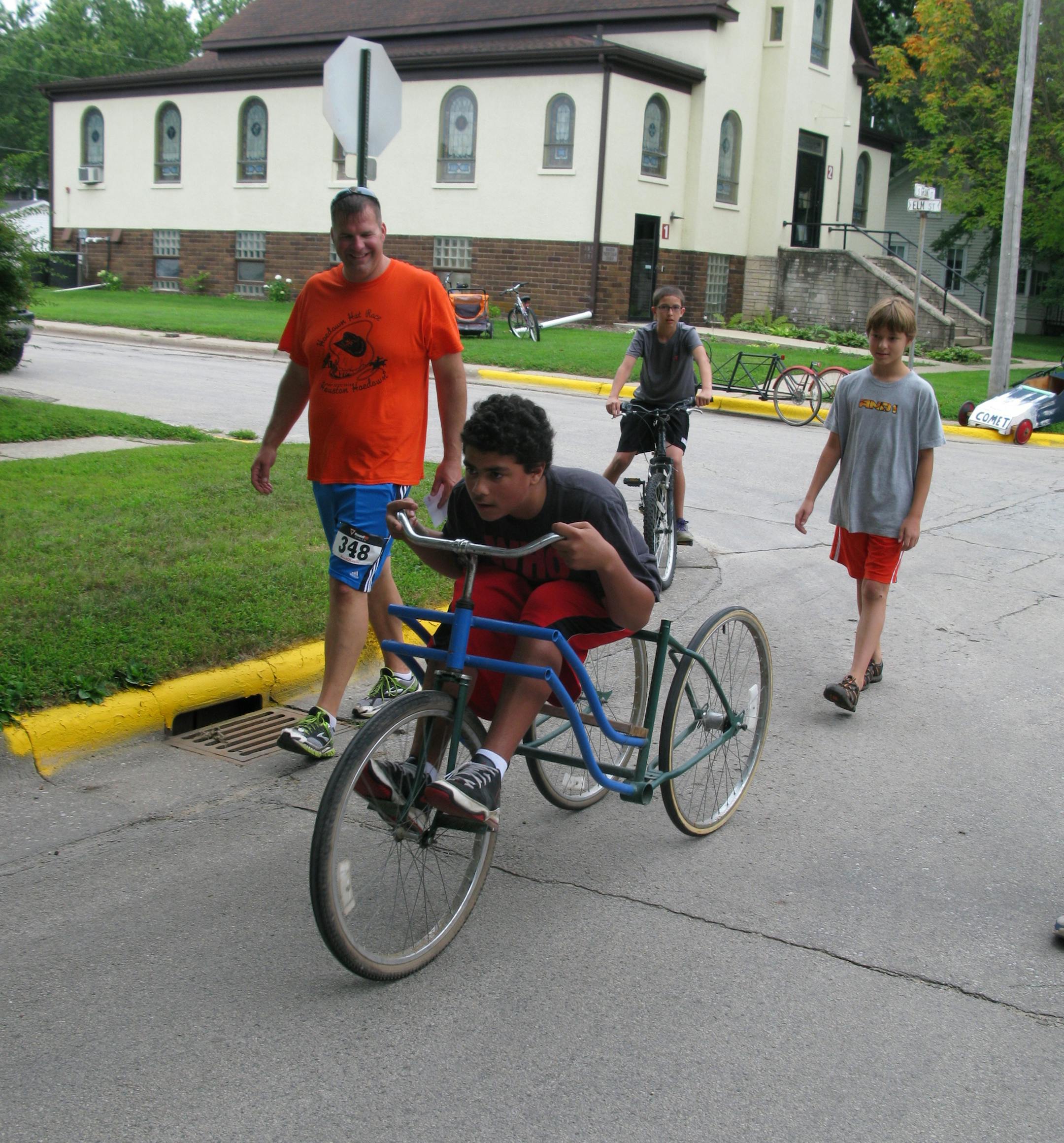 Houston City Councilman Matt Schutte judges the soapbox derby competition several blocks south of the Root River Trail in Houston last weekend. The event was part of the annual Houston Hoedown.