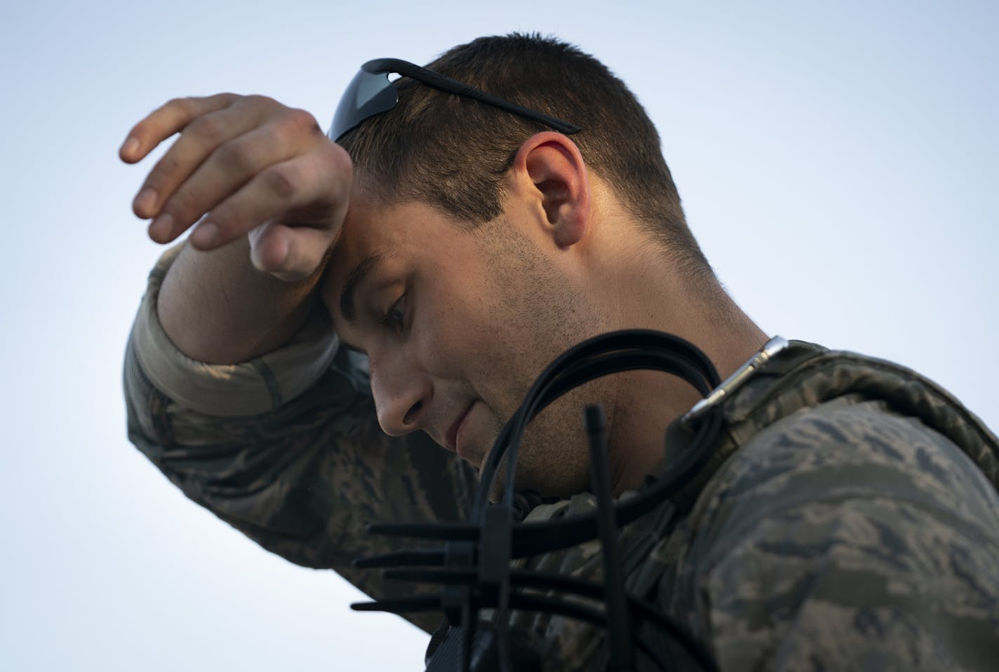 Senior Airman Nathan Van Beusekom wiped his brow in the 90 degree weather as he wanted for orders in St. Paul, Minn., on Monday, June 1, 2020. ] RENEE JONES SCHNEIDER renee.jones@startribune.com