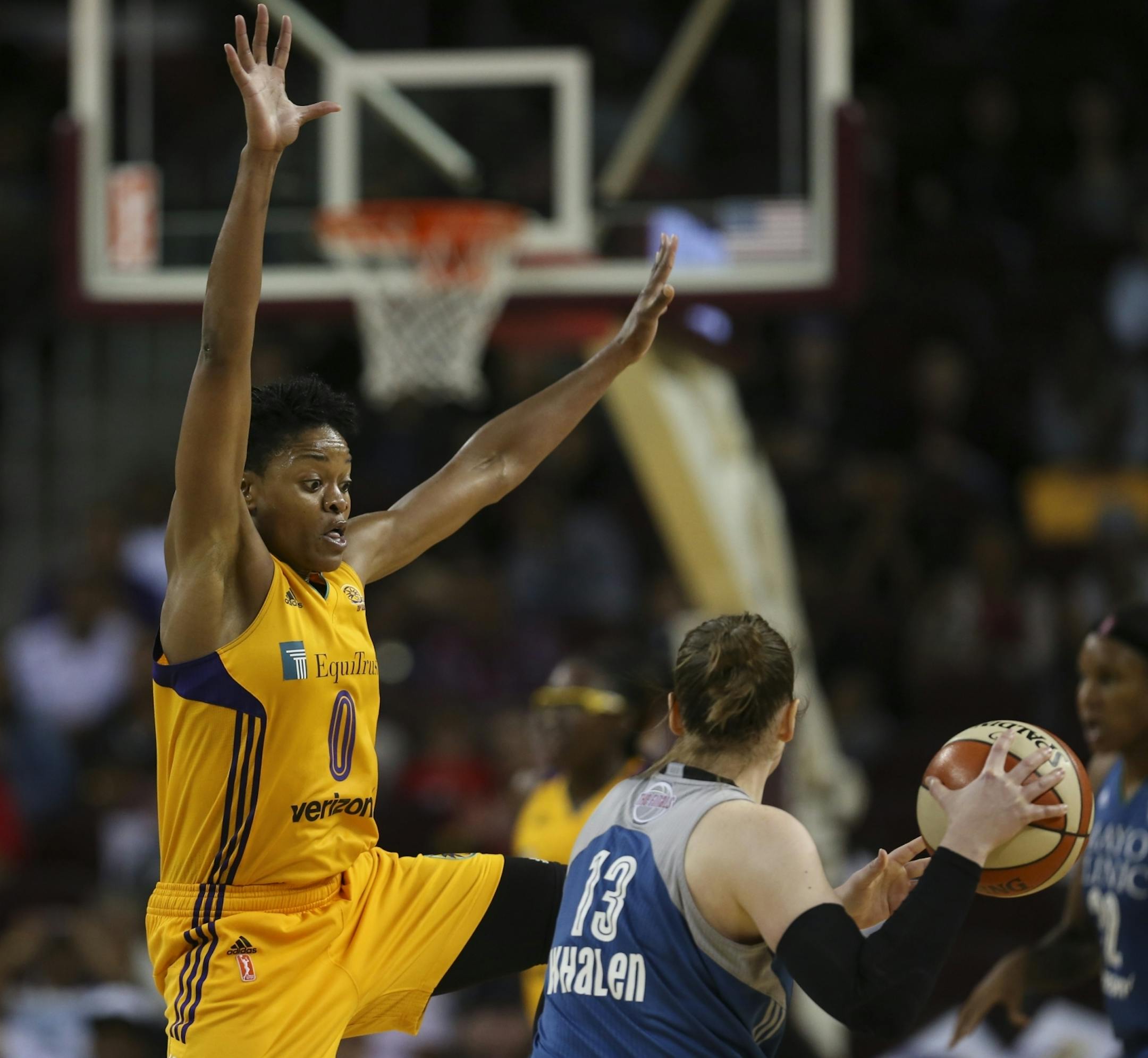 Los Angeles Sparks guard Alana Beard (0) defended Minnesota Lynx guard Lindsay Whalen (13) as she brought the ball upcourt in the fourth quarter.
