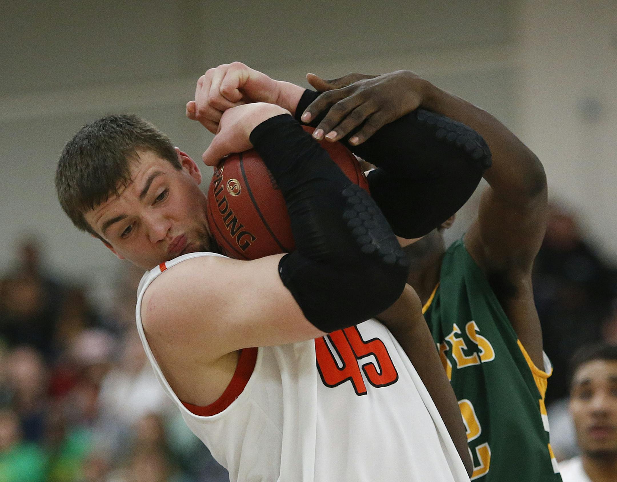 Osseo's Ian Theisen fought for possession of the ball with Park Center's Isaac Matthews during the first half of the sectional finals in Rogers, Min., Friday, March 15, 2013. Park Center won 73-71 over Osseo. ] (KYNDELL HARKNESS/STAR TRIBUNE) kyndell.harkness@startribune.com