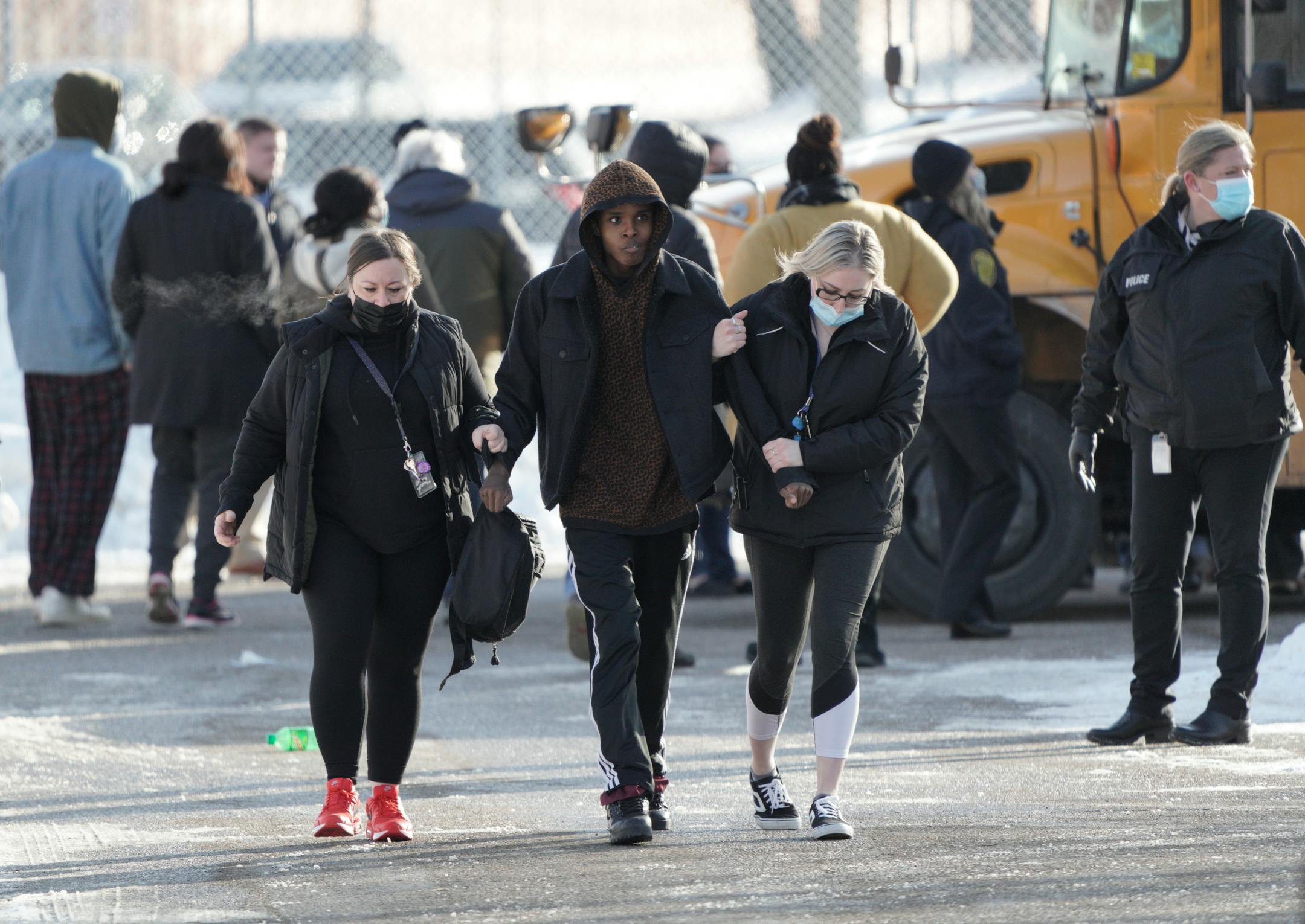 One student was shot and killed, and another severely wounded on the sidewalk outside the South Education Center, an alternative school in the Intermediate District 287 that serves students from pre-K to age 21. Here, students reunite with parents and caregivers after the school was locked down for a few hours Tuesday, Feb. 1, 2022 in Richfield, Minn. ] Brian Peterson ¥ brian.peterson@startribune.com