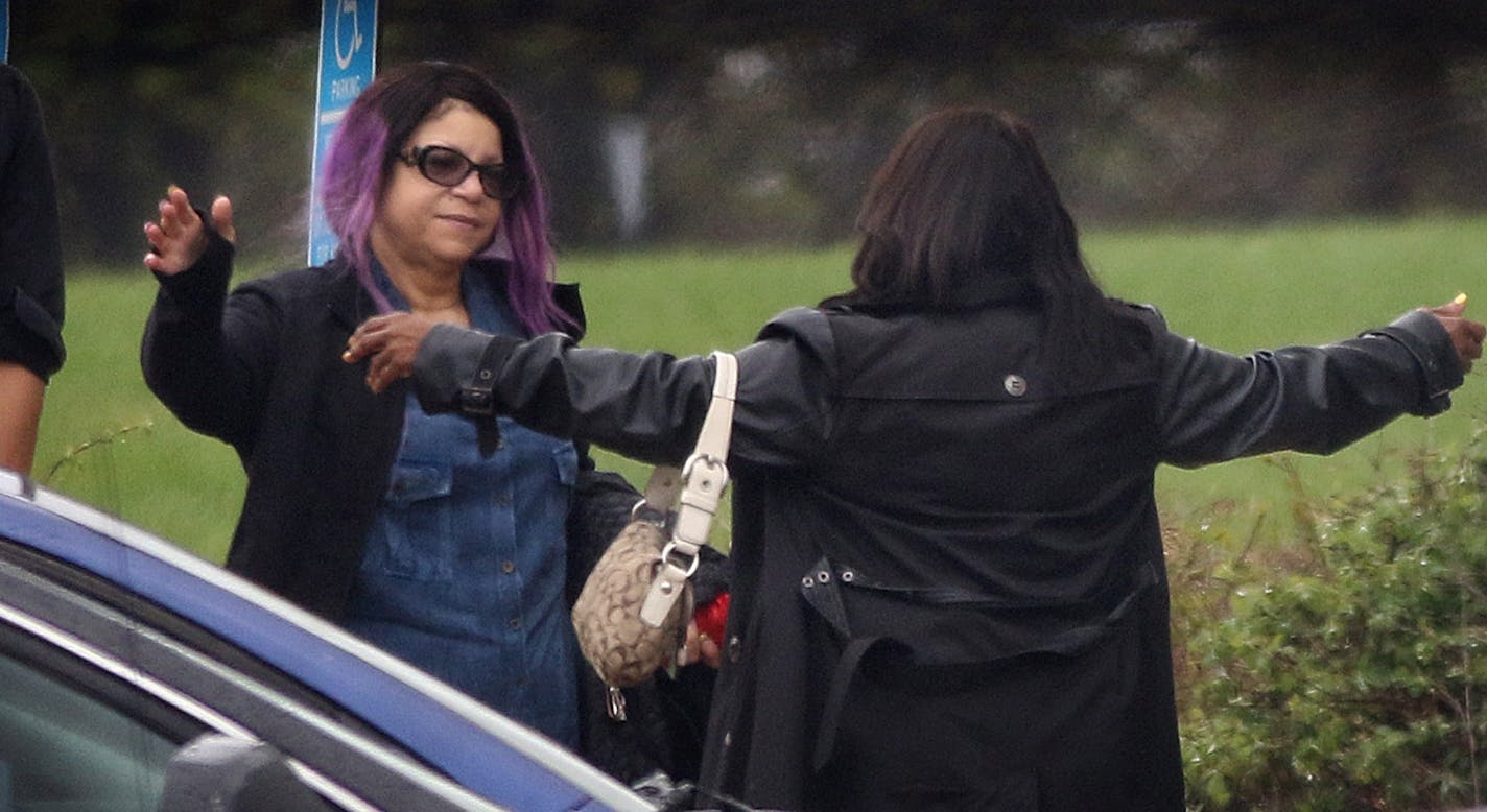 Tyka Nelson (facing camera), sister of Prince, was embraced near an entryway at Paisley Park early on the afternoon that her brother was found dead at the complex in Chanhassen.