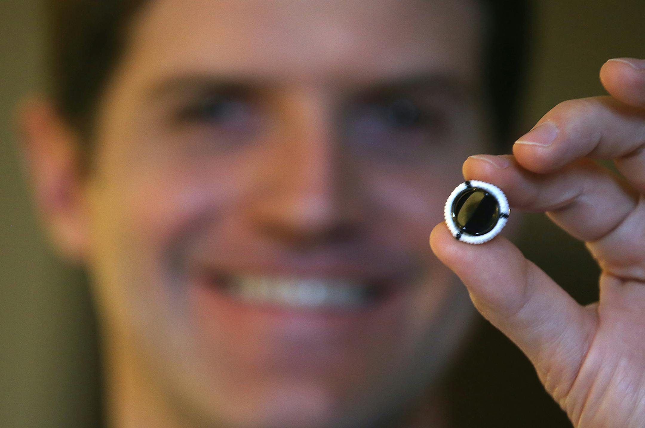 Dr. Robroy MacIver held up a new medical device made for gravely ill young children who have bad heart valves, at the University of Minnesota Amplatz Children's Hospital, Monday, March 9, 2015 in Minneapolis, MN. The device, made by St. Jude, is the only one on the market intended for kids under 5. It's tiny, just 15 mm wide, about half the size of a typical artificial valve. In an unusual twist, the company says it has been pushed by the FDA to seek approval for the device. The company says the