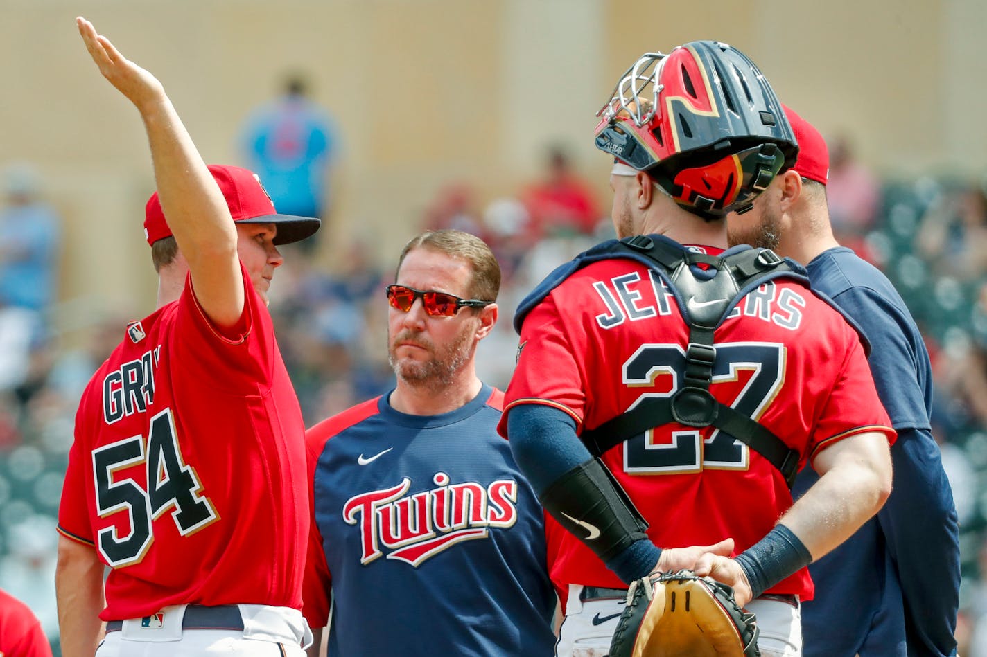 Minnesota Twins starting pitcher Sonny Gray (54) stretches his arm in discussions with his team in the seventh inning of a baseball game against the Kansas City Royals, Sunday, May 29, 2022, in Minneapolis. Gray left the game and the Twins won 7-3. (AP Photo/Bruce Kluckhohn)