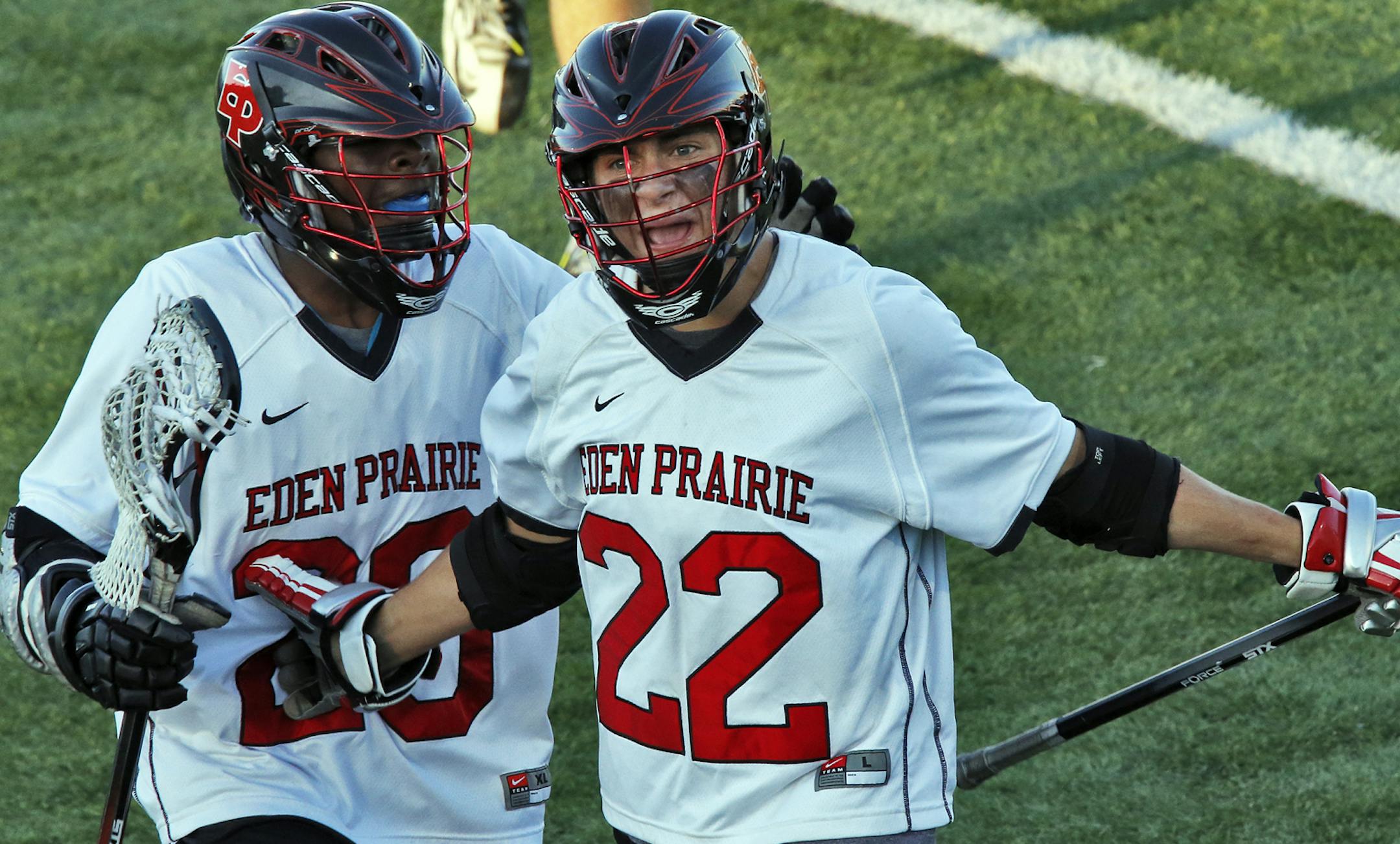 Boys lacrosse state championship game. Eastview vs. Eden Prairie. Eden Prairie's JD Spielmann, left congratulated teammate Nic Bentz (22) after Bentz scored a first quarter goal. (MARLIN LEVISON/STARTRIBUNE(mlevison@startribune.com (cq )