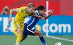 Sweden's Therese Sjogran (15) and United States' Sydney Leroux chase down the ball during first-half FIFA Women's World Cup soccer game action in Winn