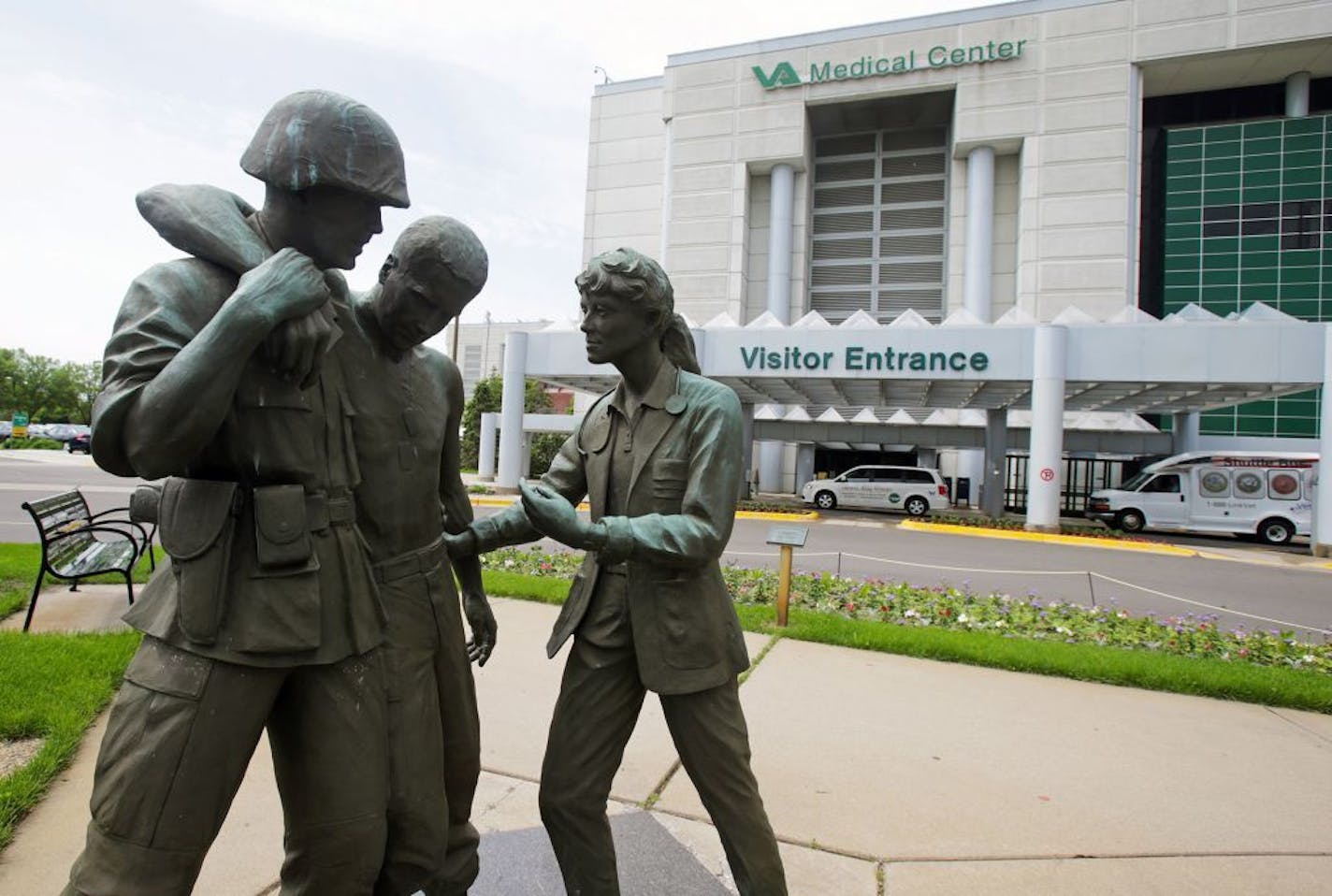 In this June 9, 2014 file photo is a sculpture portraying a wounded soldier being helped on the grounds of the Minneapolis VA Hospital.