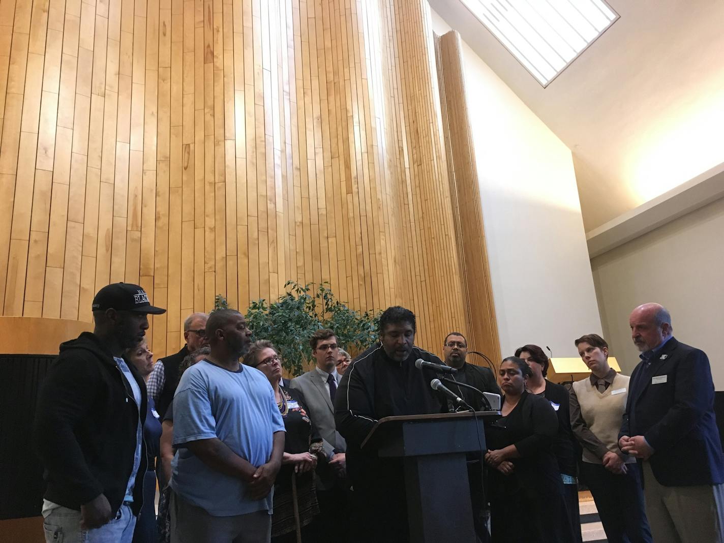 National activist the Dr. Rev. William Barber II spoke at a news conference Monday about the fatal shooting of Philando Castile. Castile's uncle, Clarence Castile, dressed in blue, stood to the side with Rev. Danny Givens Jr., far left. Castile and Givens also spoke about seeking justice in the shooting.