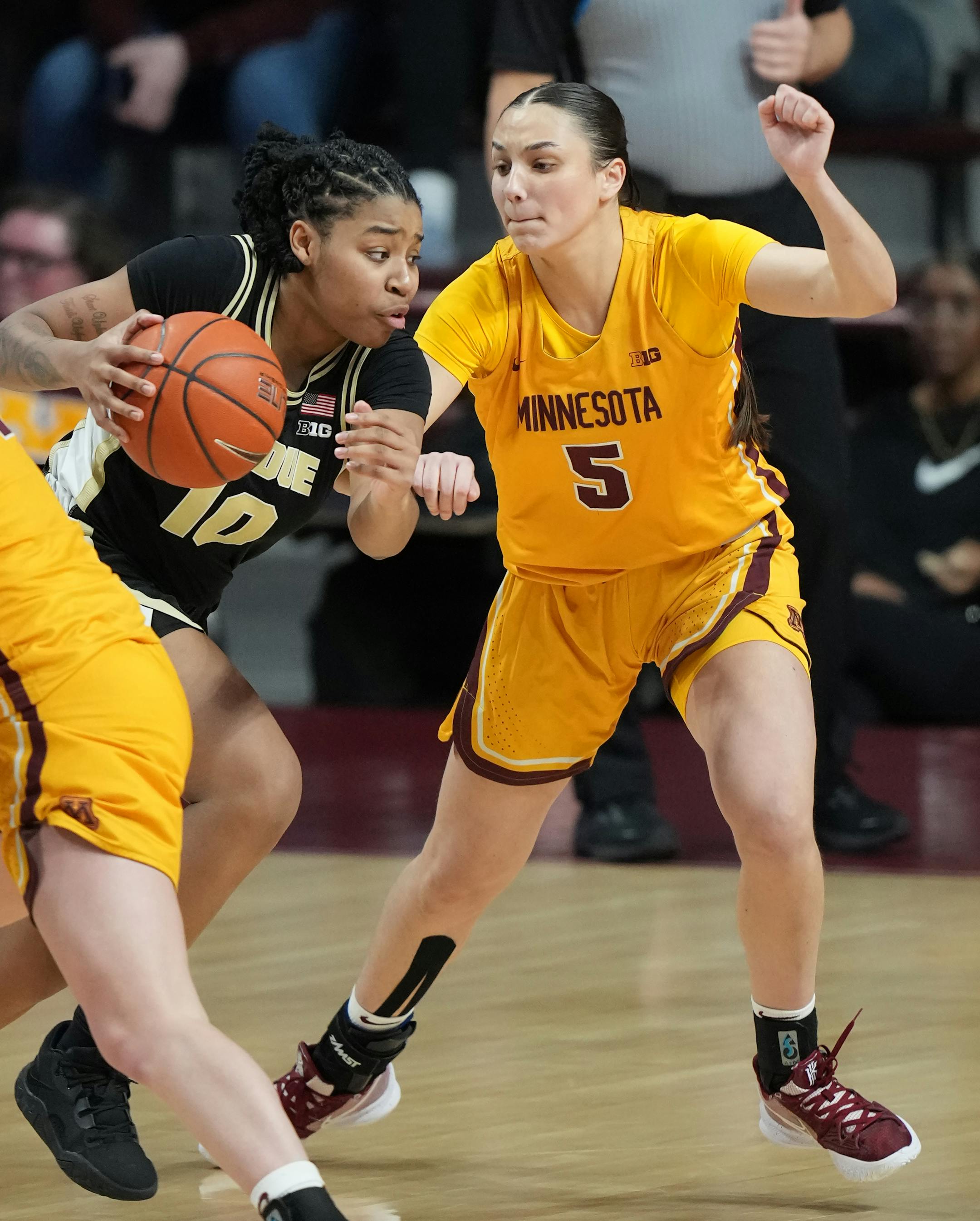 Purdue guard Jeanae Terry (10) drives against Minnesota Gopherss Maggie Czinano (5).