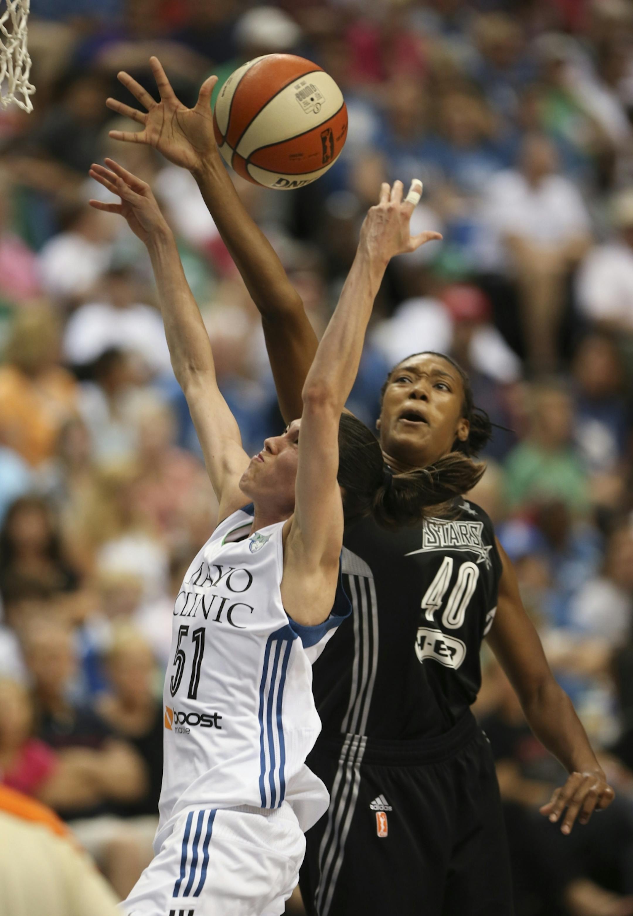 San Antonio's Kayla Alexander stripped the Lynx' Anna Cruz of the ball as she drove to the hoop in the fourth quarter Sunday night at Target Center.