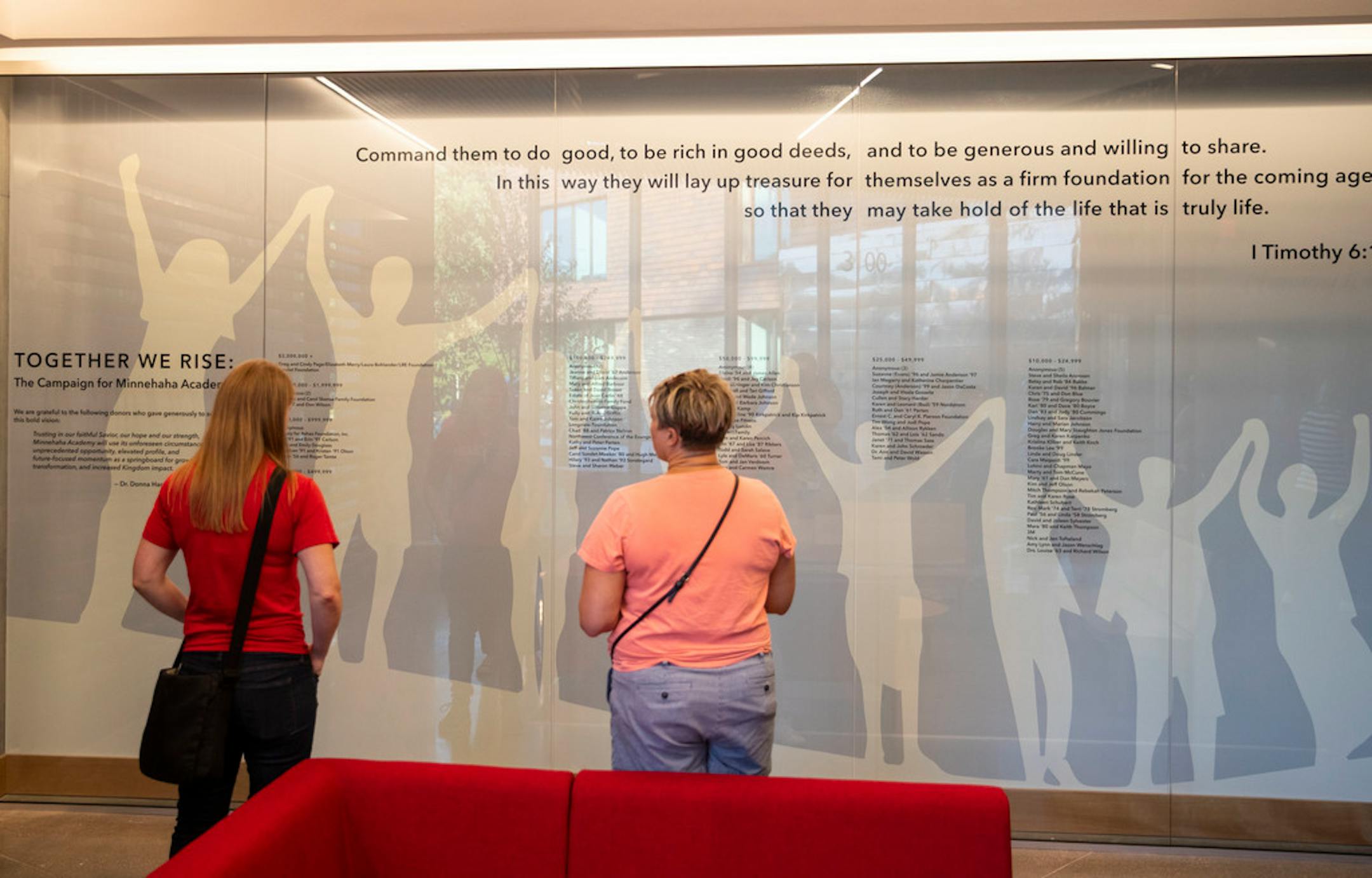 People admired the mural to honor the lives lost in the old school building and the rebuilding efforts.