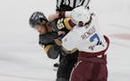 Vegas Golden Knights right wing Keegan Kolesar (55) fights Colorado Avalanche defenseman Dan Renouf (2) during the first period of an NHL hockey game 