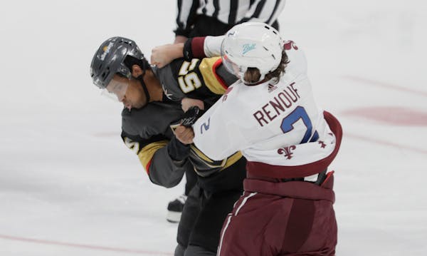 Vegas Golden Knights right wing Keegan Kolesar (55) fights Colorado Avalanche defenseman Dan Renouf (2) during the first period of an NHL hockey game 