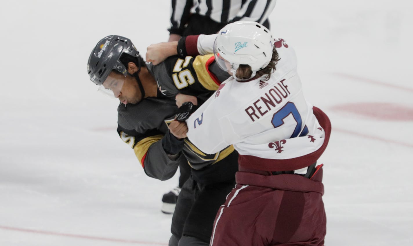 Vegas Golden Knights right wing Keegan Kolesar (55) fights Colorado Avalanche defenseman Dan Renouf (2) during the first period of an NHL hockey game in Denver, Saturday, March 27, 2021. (AP Photo/Joe Mahoney)