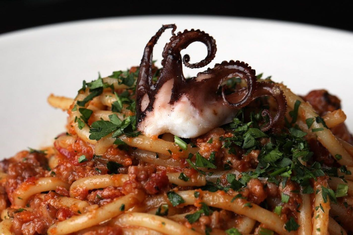 The octopus bolognese plate with bucatini, masago, and pancetta at Octo Fishbar.