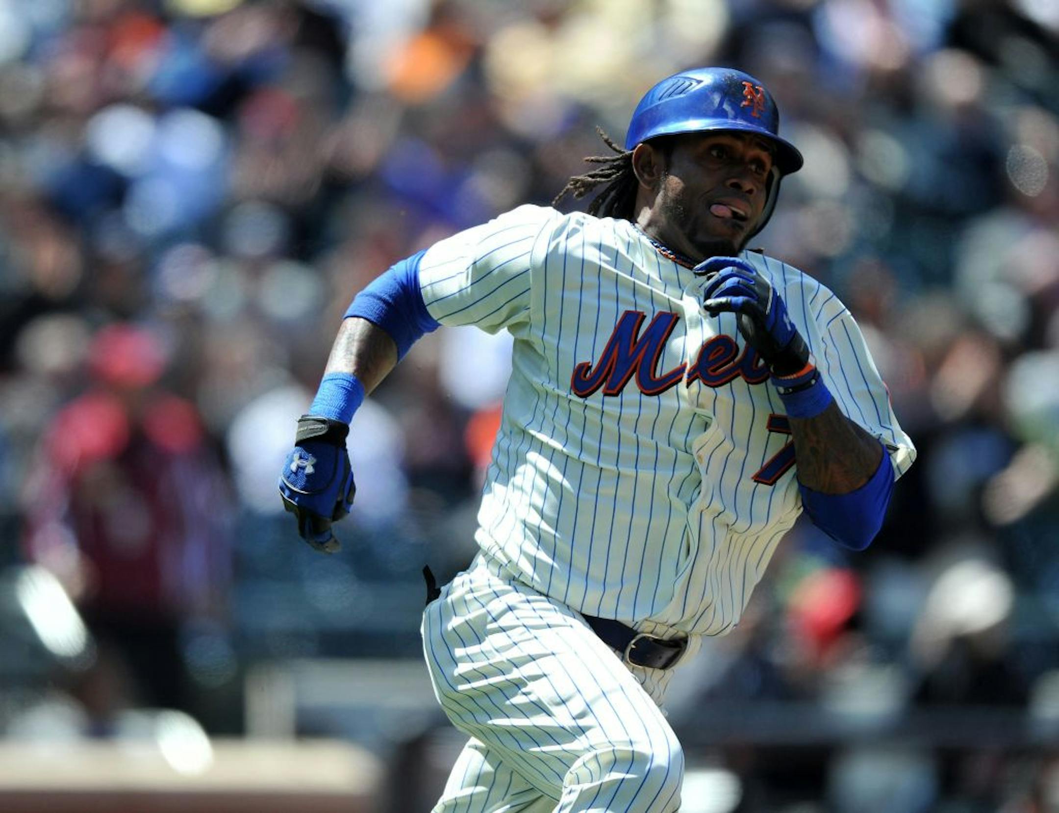 New York Mets shortstop Jose Reyes runs up the first base line after connecting for a two-run triple in the second inning against the San Francisco Giants at CitiField in Queens, New York, Thursday, May 5, 2011. The Mets defeated the Giants 5-2.