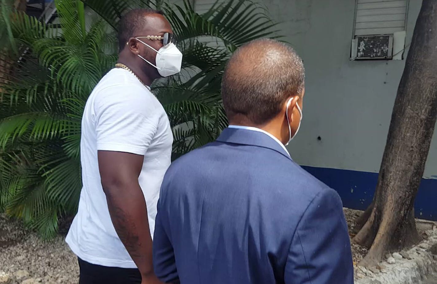 Minnesota Twins slugger Miguel Sano, right, arrives to the Prosecutor's Office accompanied by his lawyer, in his hometown San Pedro de Macoris, Dominican Republic, Thursday, June 25, 2020. Authorities in the Dominican Republic have opened an investigation into allegations the first baseman participated in the kidnapping and beating of a man in his homeland. Sano, who signed a three-year, $30 million contract with the Twins in January, denies the allegation and has said he's being blackmailed. (A