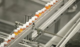 FILE- In this July 10, 2018, file photo bottles of medicine ride on a belt at a mail-in pharmacy warehouse in Florence, N.J. Drug companies are still 