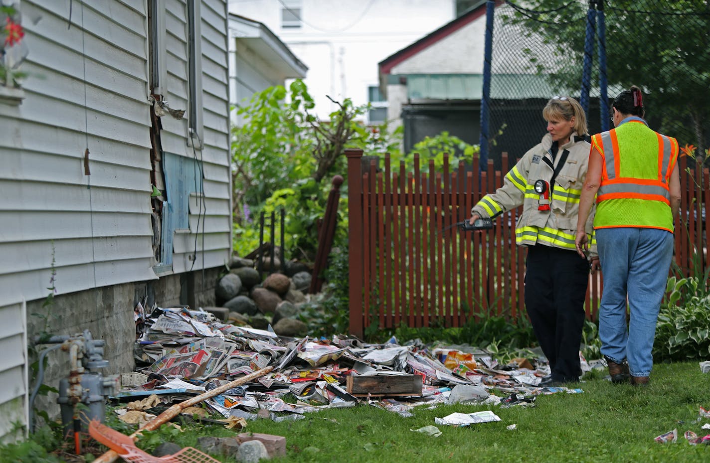 St. Paul Fire crew and city officials worked on the aftermath of a fire at 1485 Hamline Avenue North in St. Paul, MN, Tuesday July 9, 2013.(ELIZABETH FLORES/STAR TRIBUNE) ELIZABETH FLORES &#x2022; eflores@startribune.com