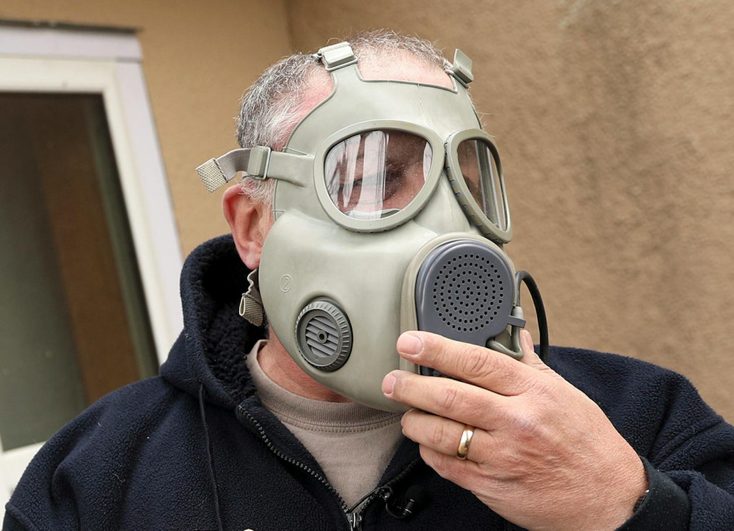 Bryan Korbel of Columbia Heights is prepared for disaster. His supplies include gas masks from Fleet Farm.