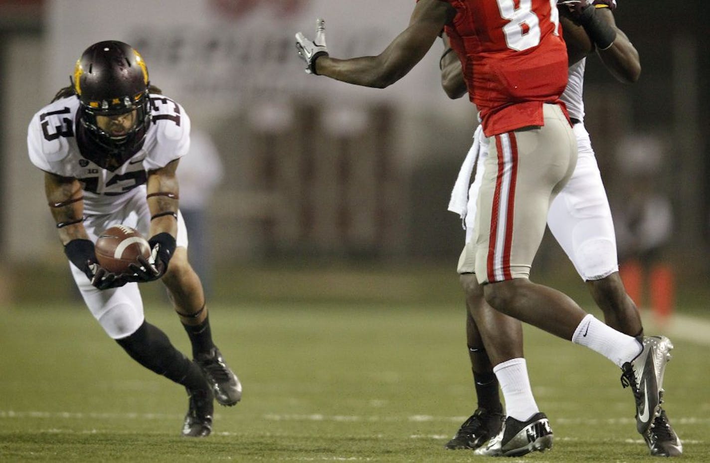 Derrick Wells (13) intercepted a pass in the fourth quarter. Minnesota beat UNLV by a final score of 30 – 27 in triple overtime.