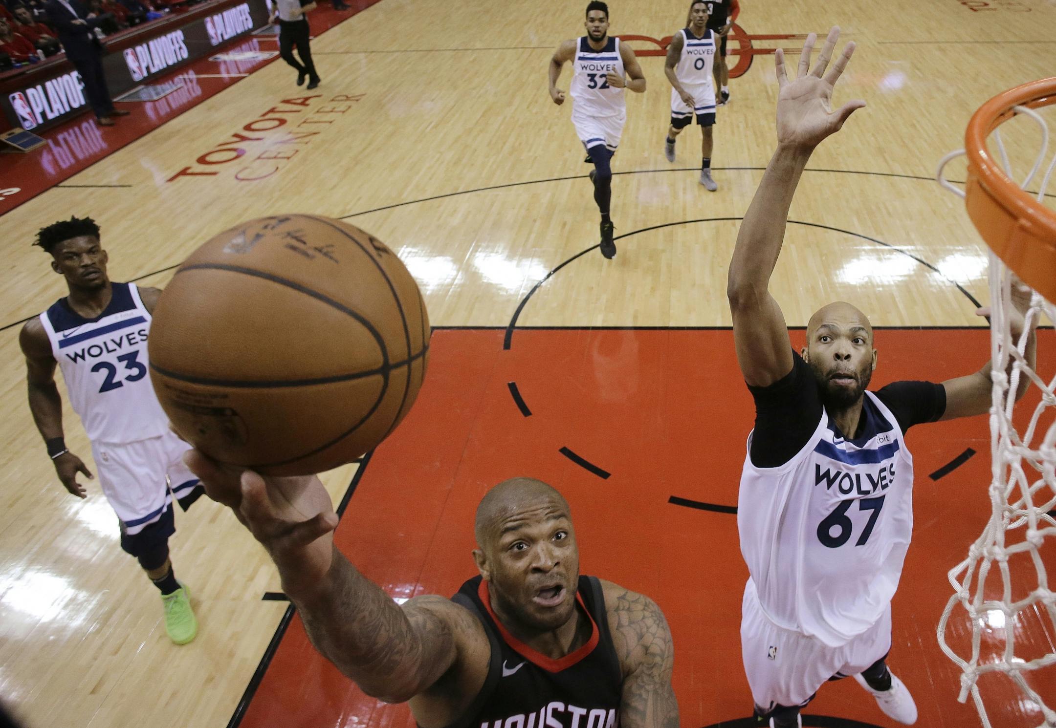 Houston Rockets forward PJ Tucker, left, drives to the basket as Minnesota Timberwolves forward Taj Gibson (67) defends during the first half in Game 5 of a first-round NBA basketball playoff series Wednesday, April 25, 2018, in Houston.