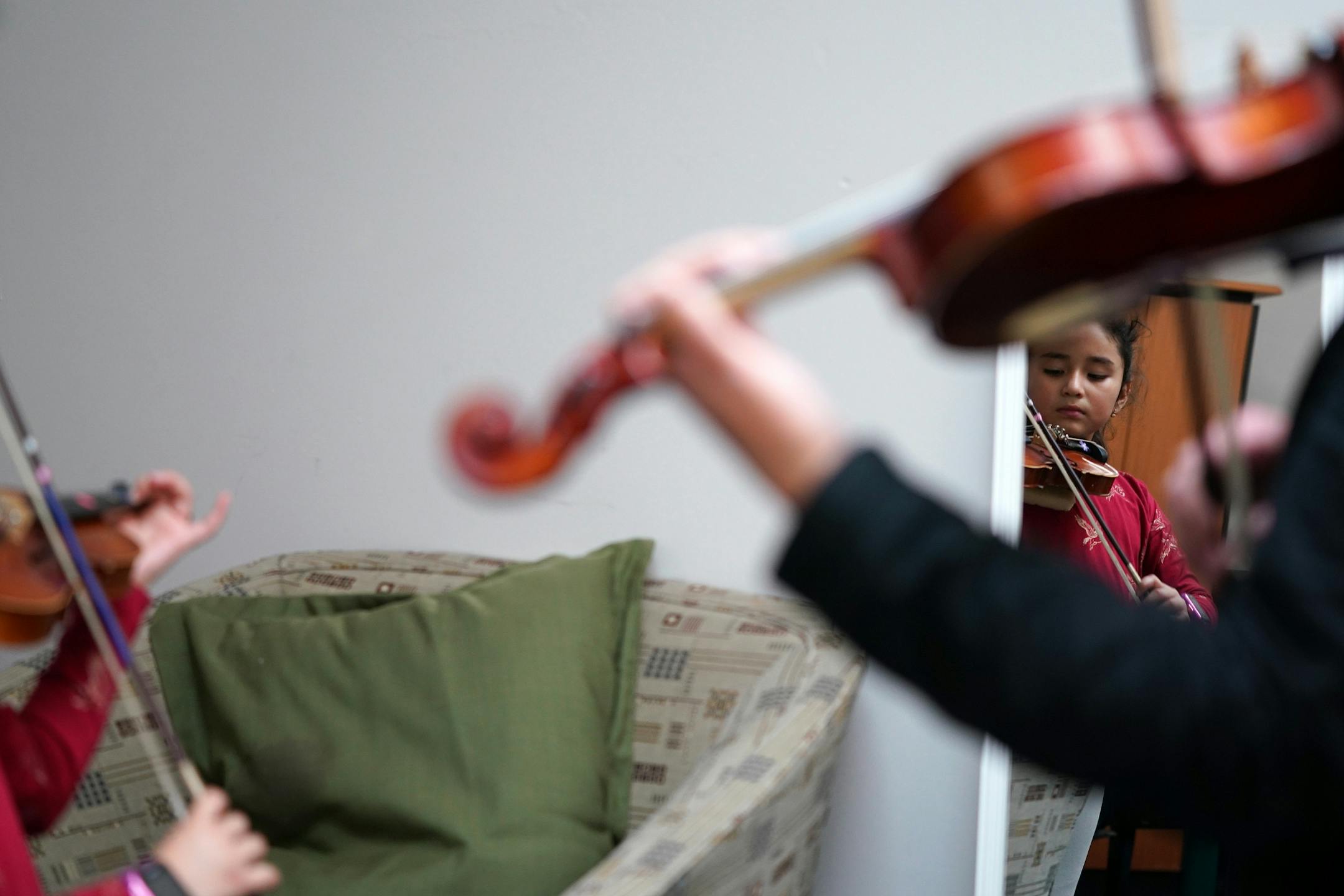 Instructor Ellie Fregni worked with Rafhaella Jimenez, 8, during her violin lesson Wednesday evening at Hopewell Music.