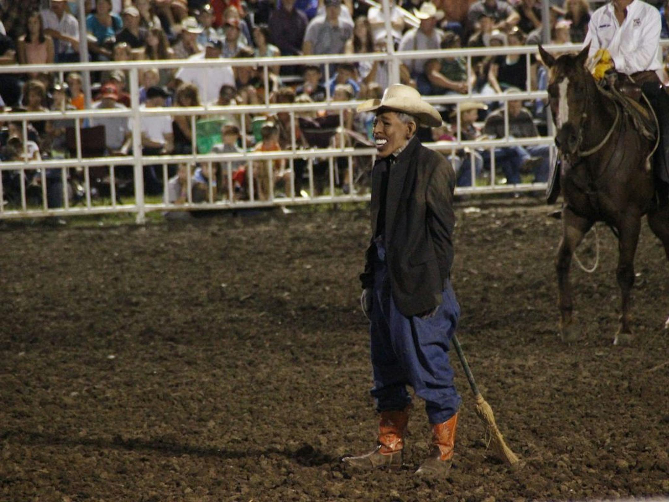 This photo provided by Jameson Hsieh shows a clown wearing a mask intended to look like President Obama at the Missouri State Fair.