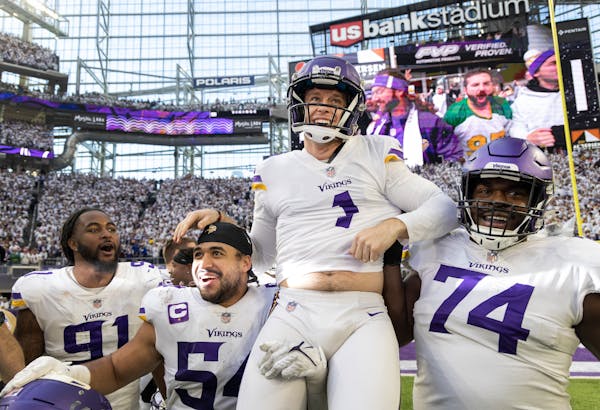 Greg Joseph (1) of the Minnesota Vikings celebrates after a 61-yard field goal to win the game.
