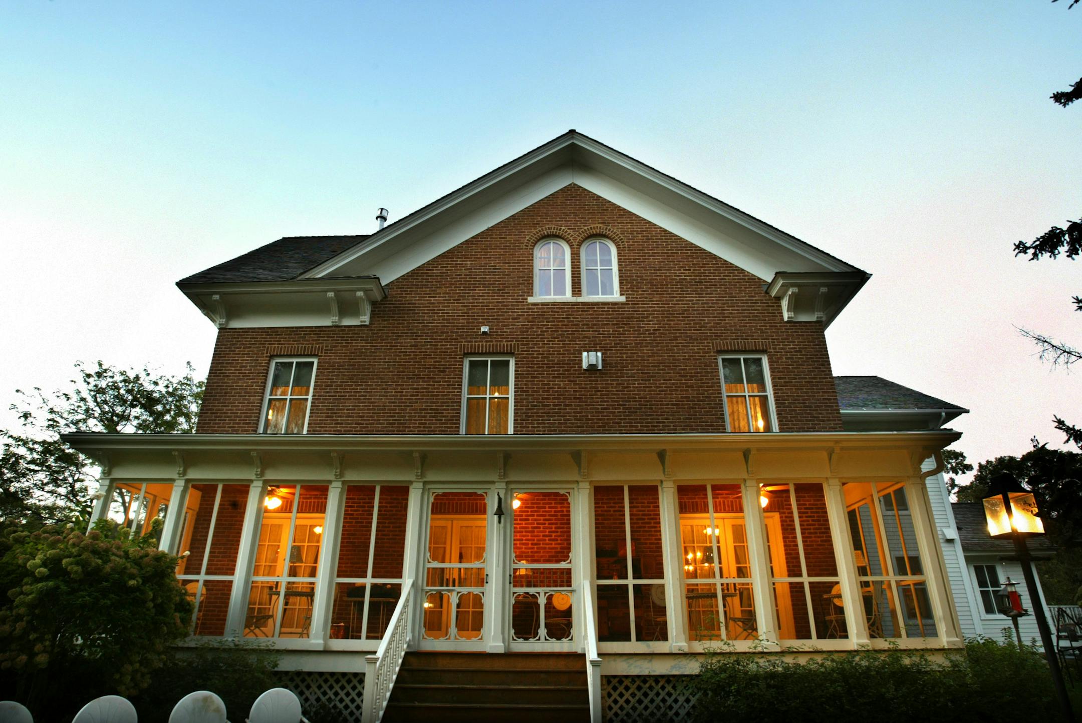 Joel Koyama/Star Tribune The Round Barn Farm B&B is a rural retreat located on a hill just off Highway 61 near Red Wing. Elaine and Robin Kleffman built the farmhouse with five rooms using a design inspired by a1861 plan. This is the house during twilight.
