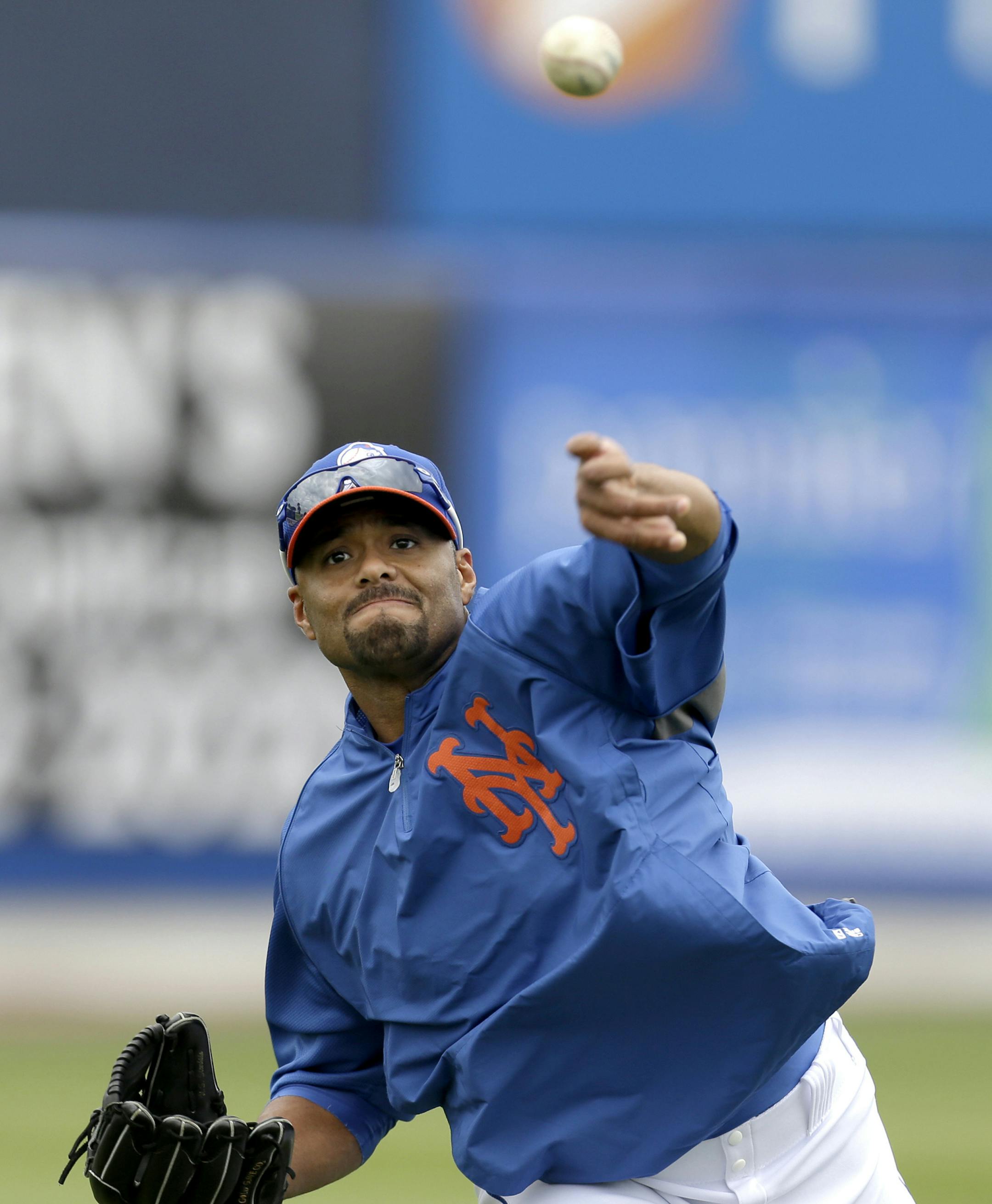 FILE - In this March 1, 2013, file photo, New York Mets pitcher Johan Santana throws while working out before the Mets' spring training baseball game Detroit Tigers in Port St. Lucie, Fla. The Mets have declined a $25 million option on the injured pitcher on Friday, Nov. 1, 2013, and will pay the left-hander a $5.5 million buyout. Santana will be 35 next season and becomes a free agent.(AP Photo/Julio Cortez, File) ORG XMIT: MIN2013110618453381
