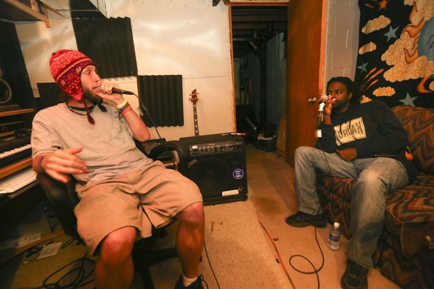 Rappers Zach Combs, left, and Harry Philibert took turns with their lyrics as More than Lights rehearsed in the basement of drummer Corey Hess' house in Brooklyn Center.