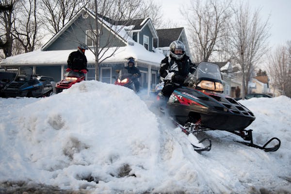 Rob Scheffler drove his snowmobile out of his front yard on March 8, 2019, in Anoka.