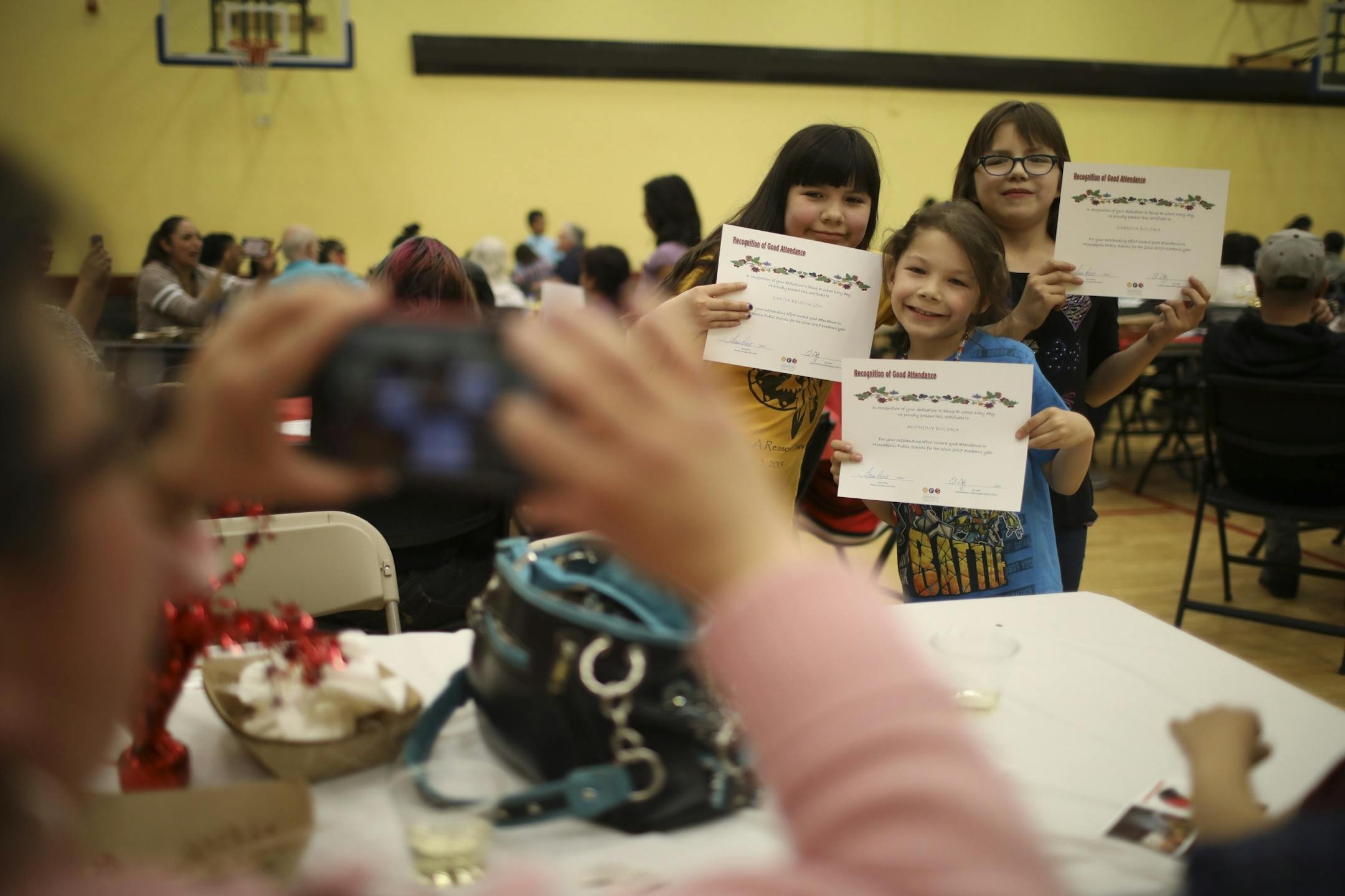 Sarita Bendickson, Anthony Boldra, and Sabrina Boldra, from left, all showed off their attendance awards so their mom could take their photo.