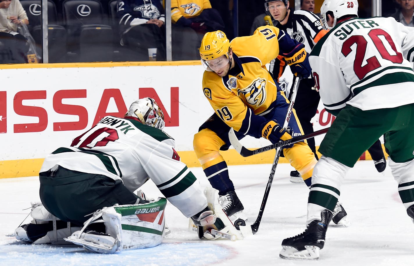 Minnesota Wild goalie Devan Dubnyk (40) blocks a shot by Nashville Predators center Calle Jarnkrok (19),of Sweden, in the second period of an NHL hockey game Saturday, Dec. 19, 2015, in Nashville, Tenn. (AP Photo/Mark Zaleski)