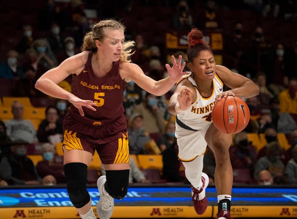 Minnesota Gophers guard Jasmine Powell (4) with a third quarter steal from Crookston Golden Eagles guard Kylie Post (5) Sunday, Oct. 31, 2021 in Minne