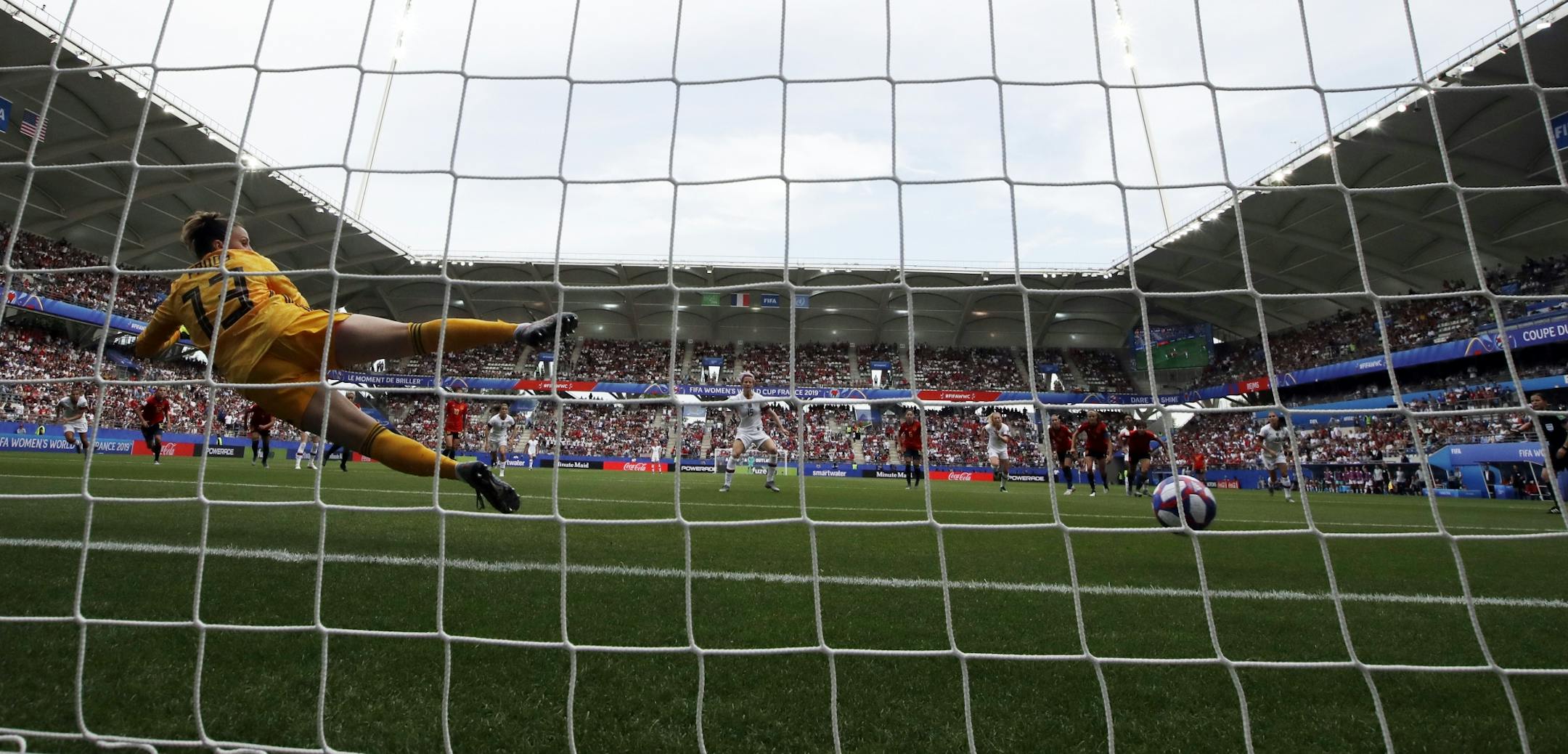 Spain goalkeeper Sandra Panos fails to stop the winning goal on Megan Rapinoe's penalty kick.