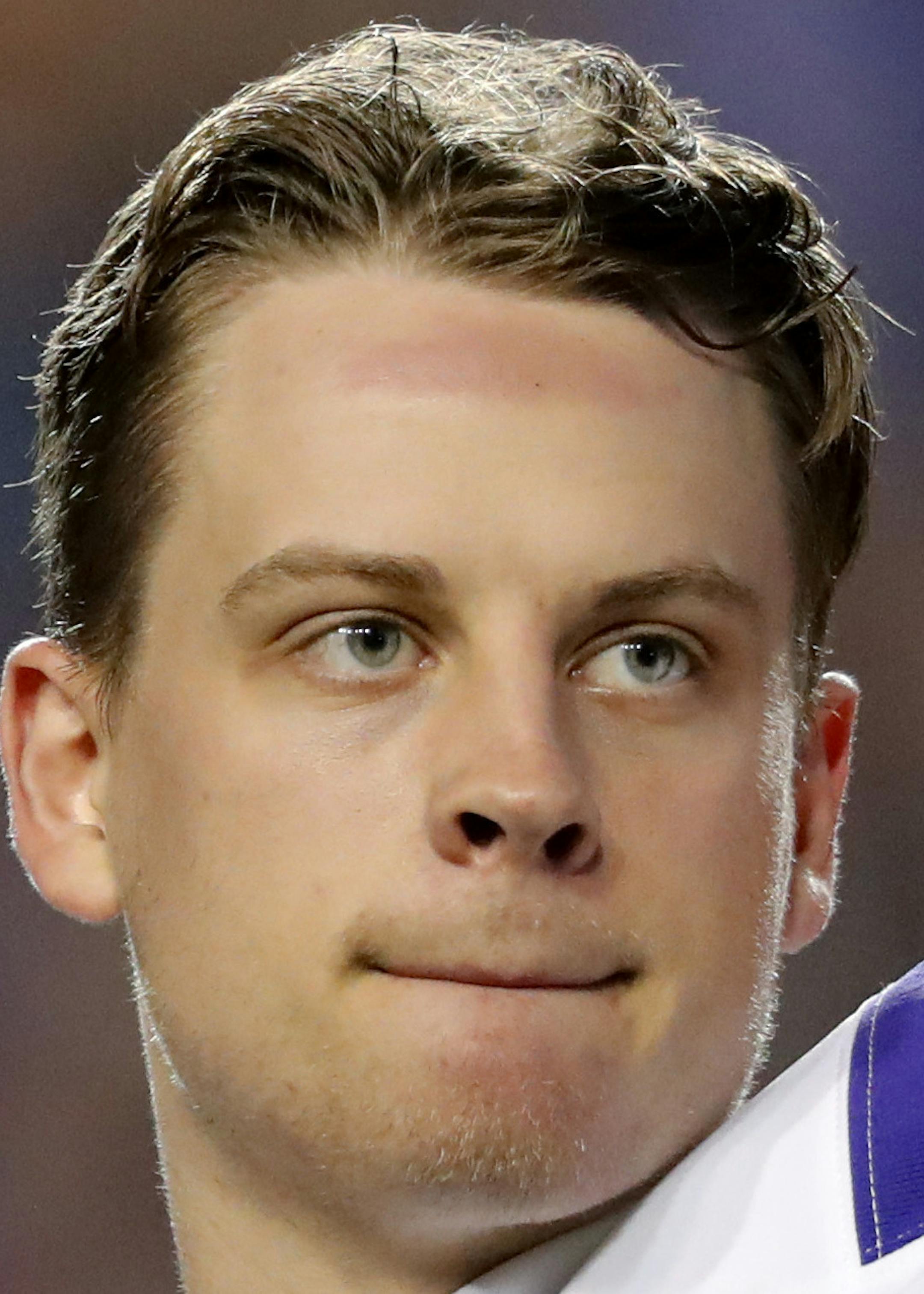 LSU quarterback Joe Burrow, who is considered a frontrunner for the Heisman Trophy, acknowledges the crowd as he is pulled from his last game in Tiger Stadium, in the fourth quarter of the team's NCAA college football matchup against Texas A&M in Baton Rouge, La., Saturday, Nov. 30, 2019. LSU won 50-7. (AP Photo/Gerald Herbert)