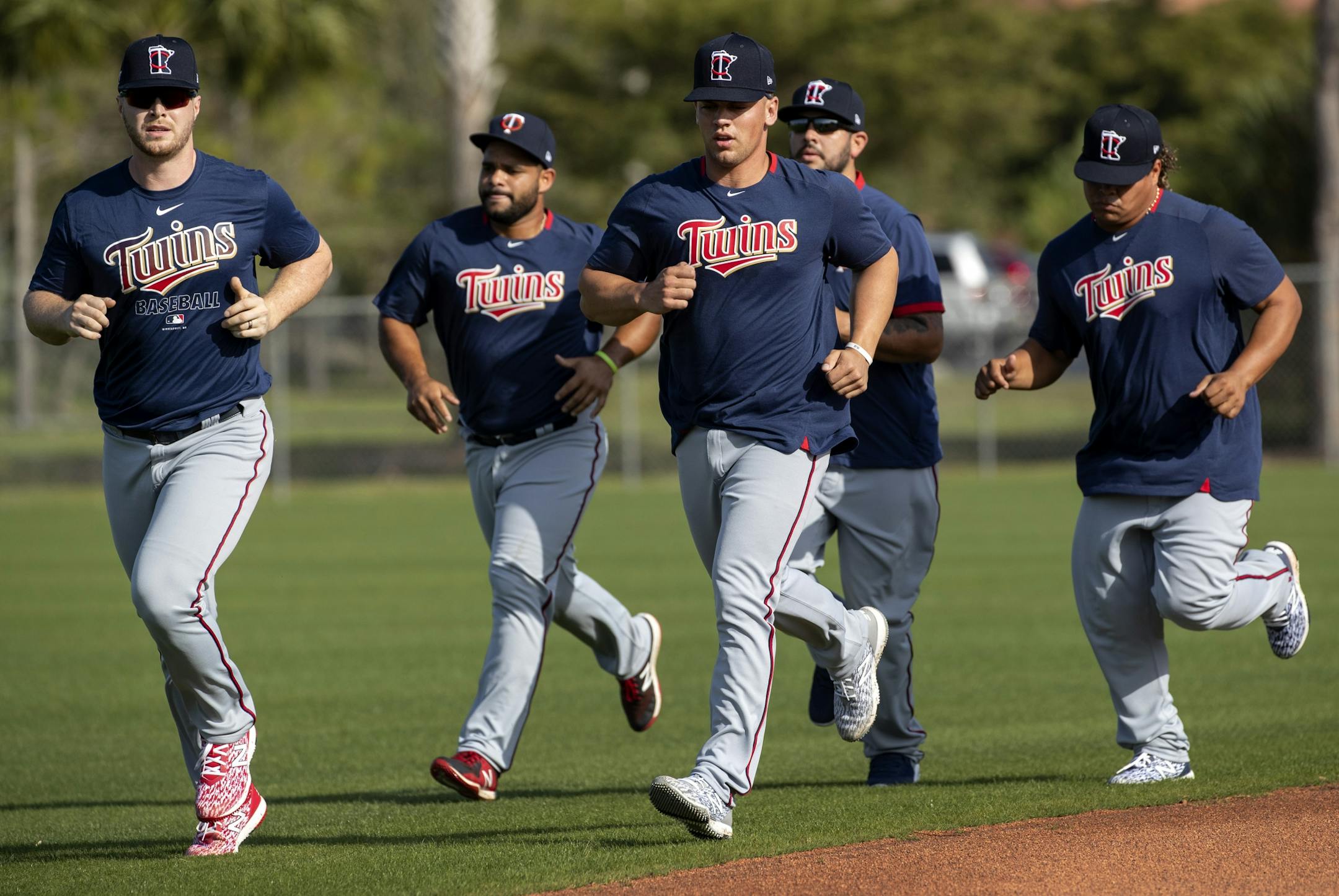 Minnesota Twins catchers warmups up before practice on Thursday.