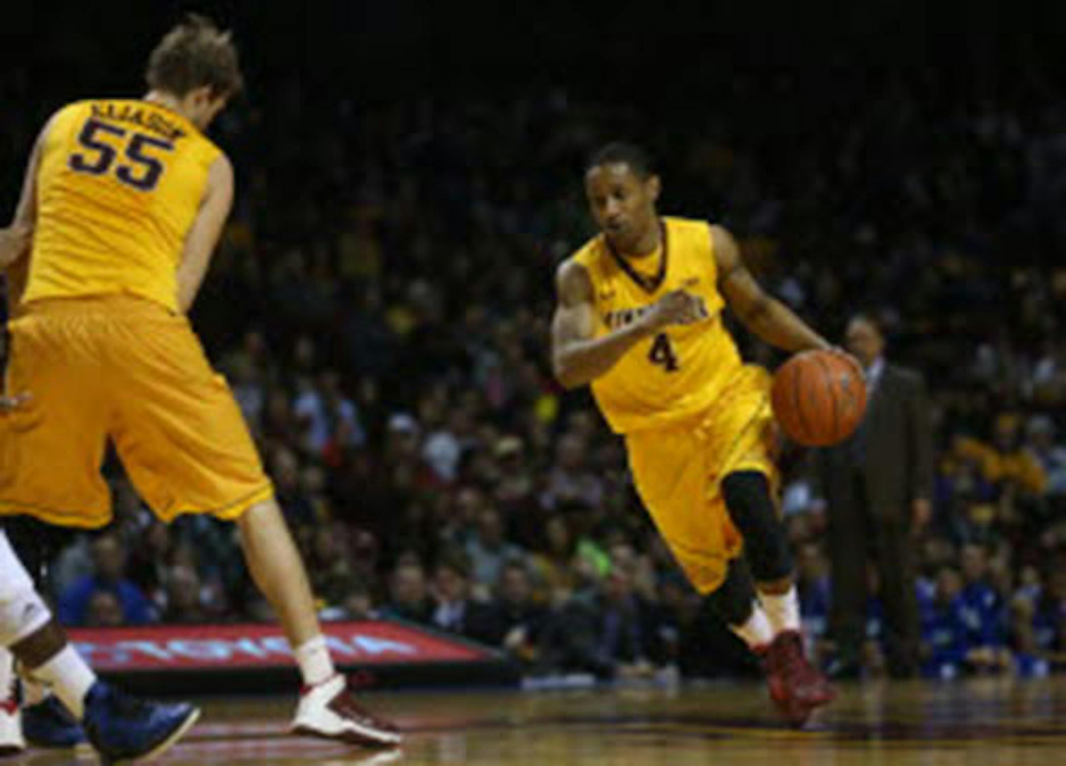 The quickness of Gophers guard DeAndre Mathieu, right, and the inside presence of teammate Elliott Eliason (55) have made significant contributions to a surprisingly diversified offense.
