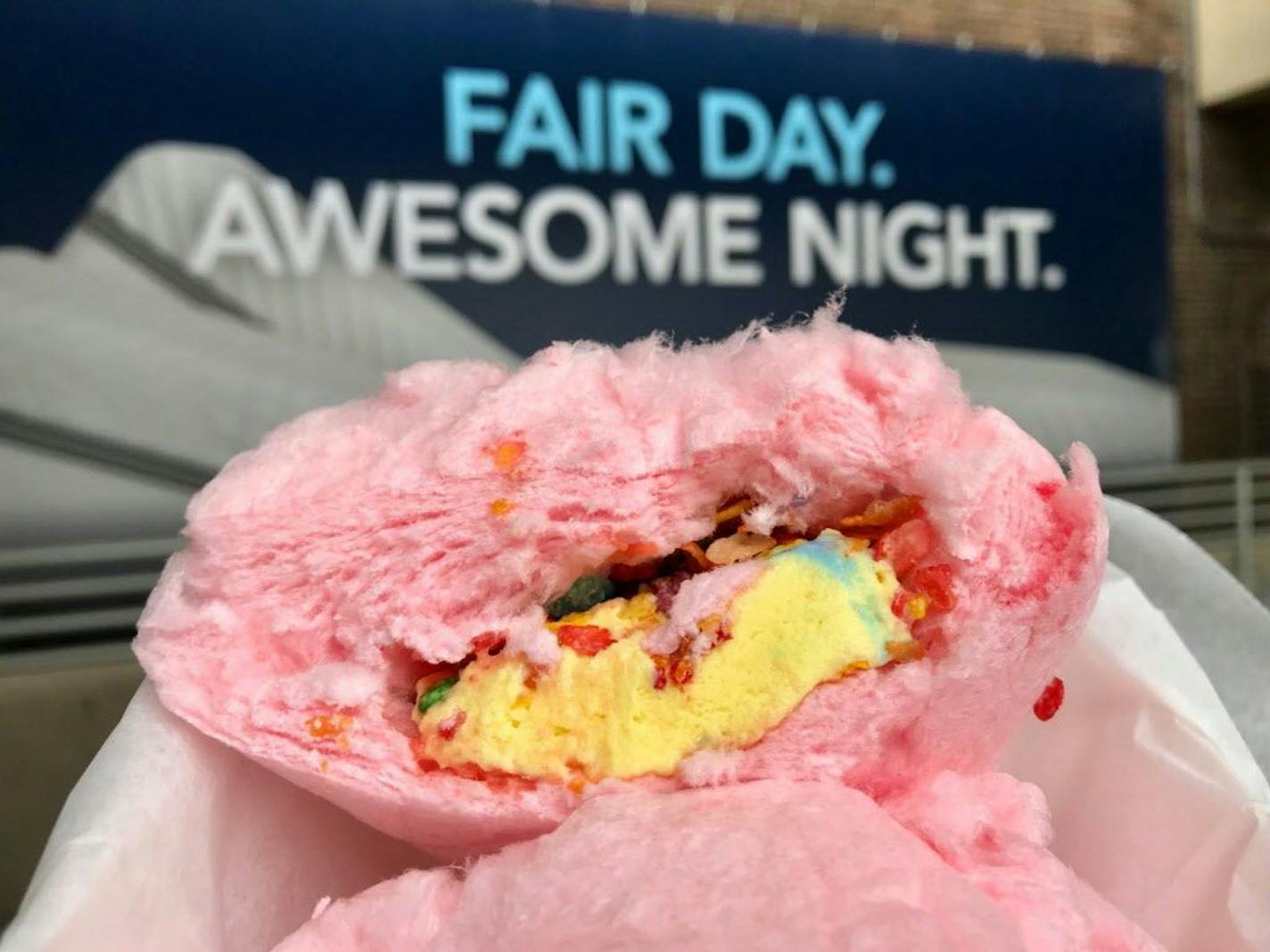 Rainbow Cloud Roll (with "Superman" ice cream), Rainbow Cloud Roll, Grandstand, $8. "It's kind of like a sugar burrito," said the nice young woman, as she rolled cartoon-colored ice cream and Fruity Pebbles in cotton candy. Hilarious, very state fair, and toothache-inducing. Photo by Rick Nelson New food at the Minnesota State Fair 2018