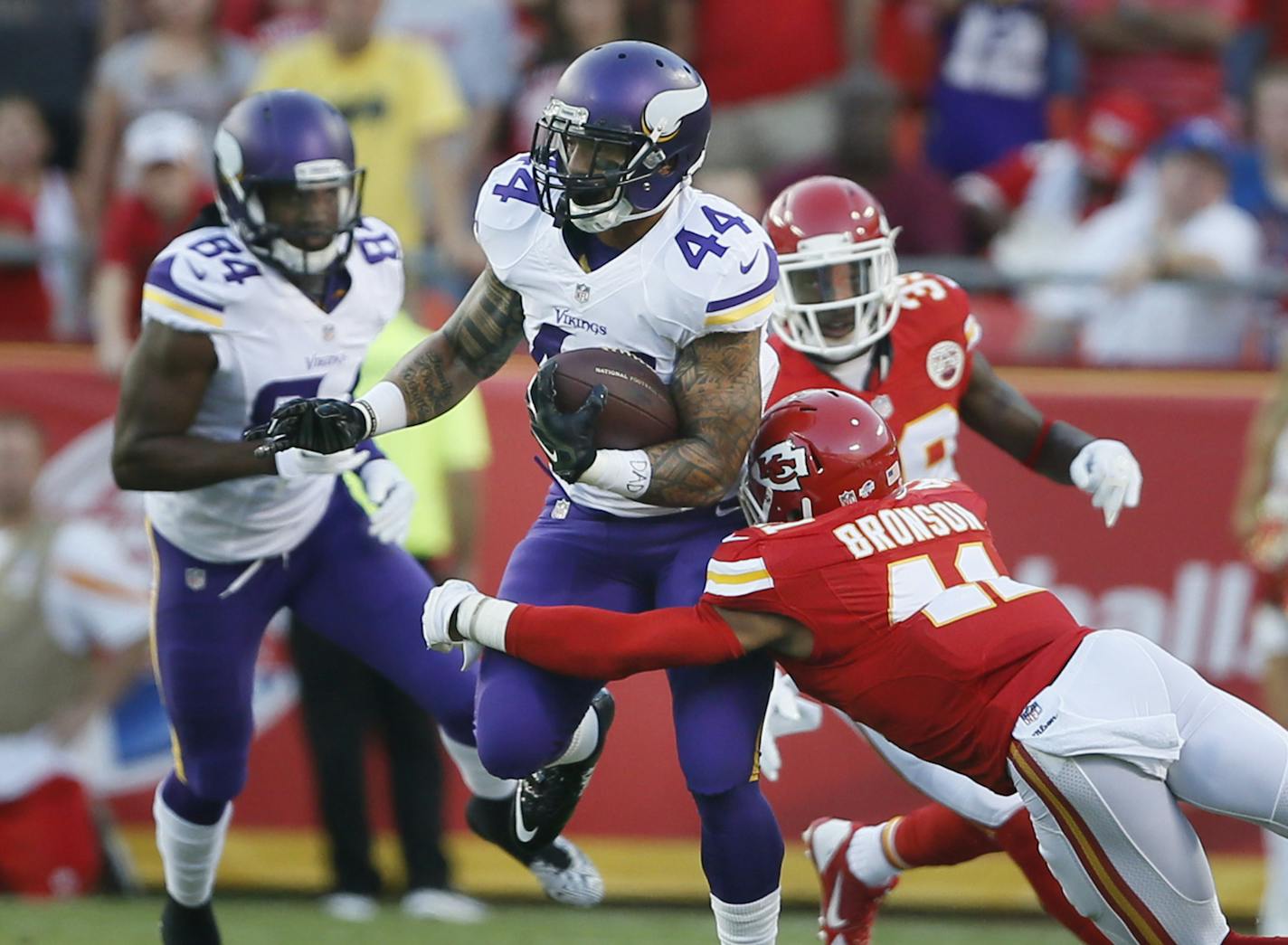 Minnesota Vikings running back Matt Asiata (44) picked up a first down as he was tackled by Kansas City Chiefs defensive back Malcolm Bronson (41) during preseason NFL football between the Minnesota Vikings and Kansas City Chiefs Saturday August 23 , 2014 in Kansas City ,MO . ] Jerry Holt Jerry.holt@startribune.com